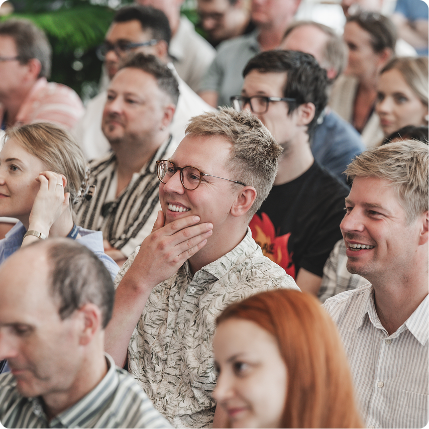 Siteimprovers attending a company presentation and team event.